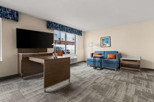 a living room with a flat screen tv and a couch at Hampton Inn & Suites Bessemer Birmingham in Bessemer