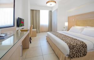 Posteľ alebo postele v izbe v ubytovaní Toledo Amman Hotel
