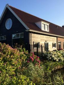 
a house with a large window in front of it at Independent Apartment Spaarne in Haarlem
