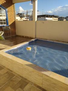 a swimming pool on the roof of a building at Pousada Casarão in Cruzília