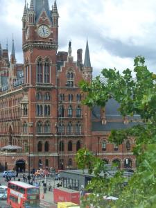a large brick building with a clock tower at The Belgrove Hotel in London