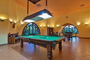 a pool table in the middle of a room at Dream Lagoon Resort & Aqua Park in Marsa Alam City
