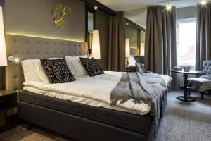 Postel nebo postele na pokoji v ubytování Lapland Hotels Oulu