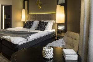 Postel nebo postele na pokoji v ubytování Lapland Hotels Oulu