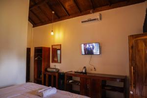 TV a/nebo společenská místnost v ubytování Nea Cottage Lombok