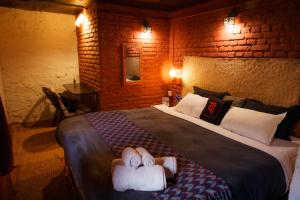 Letto o letti in una camera di Hira Guest House