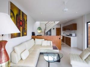 a living room with a white couch and a glass table at 2 Bed Seaview Villa 5 mins to beach A2 SDV202-By Samui Dream Villas in Koh Samui 