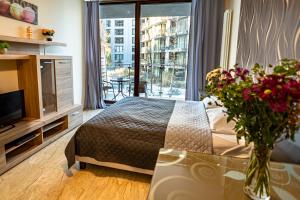Posteľ alebo postele v izbe v ubytovaní Triton Apartments