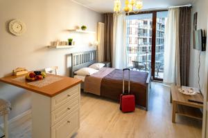 Posteľ alebo postele v izbe v ubytovaní Triton Apartments