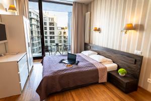 Posteľ alebo postele v izbe v ubytovaní Triton Apartments