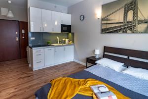 Posteľ alebo postele v izbe v ubytovaní Triton Apartments