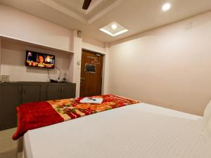Postel nebo postele na pokoji v ubytování HOTEL SUN CITY