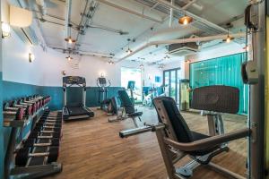 a gym with cardio equipment and treadmills at Direct pool access studio Twin Sands by Lofty in Patong Beach