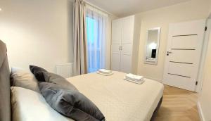 Posteľ alebo postele v izbe v ubytovaní Apartment Golden Beach by TriApart