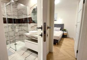 Kúpeľňa v ubytovaní Apartment Golden Beach by TriApart