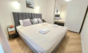 Posteľ alebo postele v izbe v ubytovaní Apartment Golden Beach by TriApart