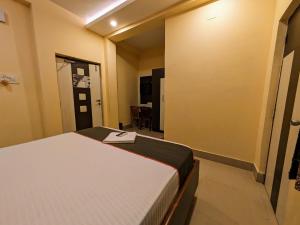 Postel nebo postele na pokoji v ubytování HOTEL SUN CITY