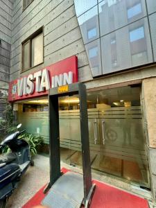 a usa inn sign in front of a building at Hotel Vista Inn, Karol Bagh, New Delhi in New Delhi