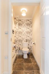 a bathroom with a toilet and a sink at Modern 3 bedroom home *EVcharging* Garden, Parking in Darlington