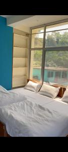Voodi või voodid majutusasutuse Ayodhya-Hotel by prithvi yatra hotel doormatry toas