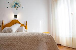 Postel nebo postele na pokoji v ubytování HOSTAL CACHE
