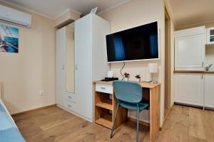 Kuchyňa alebo kuchynka v ubytovaní Palmy Apartmanhouse Maglód