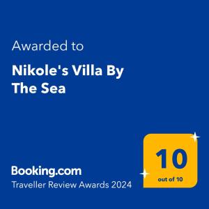 een geel bord met de tekst toegekend aan Nikoles villella door bij Nikole's Villas Luxury 180m2 in Tiros