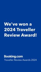 a blue sign that says weve won a traveler review award at Karlovasi house amazing sea view in Karlovasi