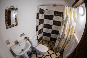 a bathroom with a toilet and a sink at Dar Arinas Fez in Fez