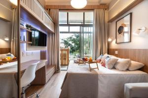 a hotel room with a bed and a window at ARQ VILA MARIANA in Sao Paulo