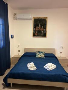 מיטה או מיטות בחדר ב-B&B Casa Vacanze Stella Di Mare