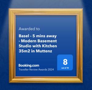 a gold picture frame with a ticket for a museum at Basel - 5 mins away - Modern Basement Studio with Kitchen 35m2 in Muttenz in Muttenz