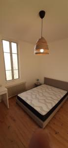 Posteľ alebo postele v izbe v ubytovaní Colocation maison - Villeurbanne près de Lyon