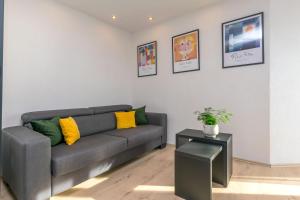 a living room with a couch and a table at Apartments Mladen in Duće