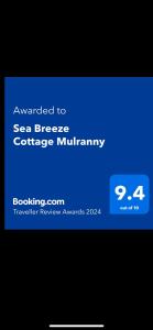 a screenshot of a cell phone with the text upgraded to sea breeze cottage military at Sea Breeze Cottage Mulranny in Mulranny