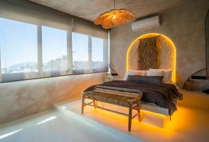 a bedroom with a bed and a large window at Noi Hotel Bodrum in Bodrum City