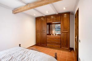 a bedroom with a bed and a window at La Casetta in Aosta