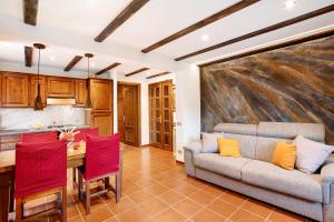 a living room with a couch and a table at La Casetta in Aosta