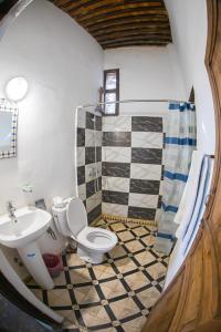 a bathroom with a toilet and a sink at Dar Arinas Fez in Fès