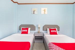 Postel nebo postele na pokoji v ubytování OYO 643 Kokview Chiang Rai