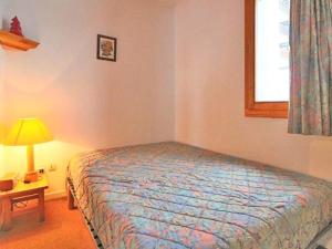 Łóżko lub łóżka w pokoju w obiekcie Appartement Montvalezan-La Rosière, 2 pièces, 6 personnes - FR-1-398-564