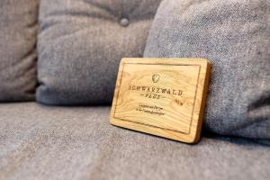 a wooden box sitting on top of a couch at Schwarzwaldnestle in Bad Wildbad