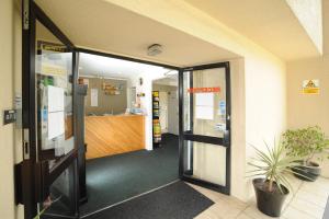 an entrance to an office building with a lobby at Ascot Epsom Motel in Auckland