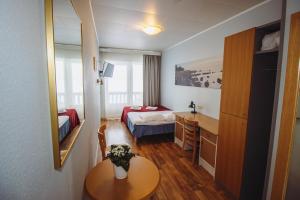Postel nebo postele na pokoji v ubytování Hotel Promenaadi + 37 fotografií