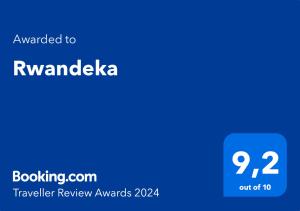 una captura de pantalla de los premios de revisión de viajes con el texto concedido a rnavada en Rwandeka en Kigali