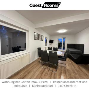 a dining room with a table and black chairs at Wohnung mit Garten EG - GuestRooms24 - Marl in Marl