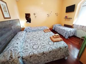 a bedroom with a bed with two towels on it at casadolcecasalatina in Latina