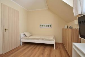 Posteľ alebo postele v izbe v ubytovaní Palmy Apartmanhouse Maglód