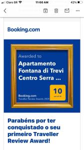 a website with a picture of a framed picture at Apartamento Fontana di Trevi Centro Serra Negra in Serra Negra