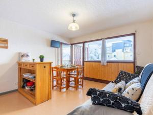 a living room with a couch and a table at Appartement Saint-Lary-Soulan, 2 pièces, 6 personnes - FR-1-296-158 in Saint-Lary-Soulan